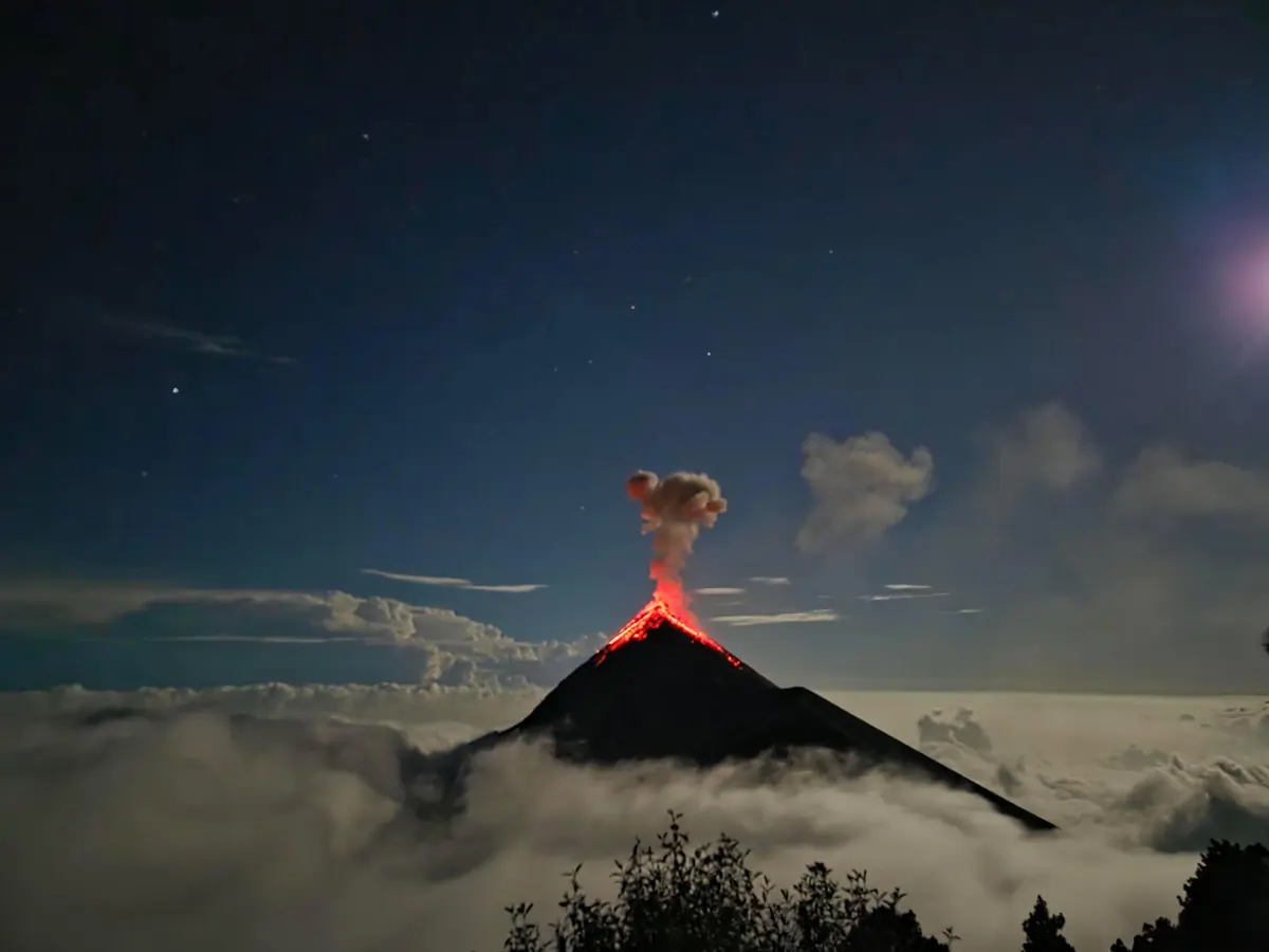 Guatemala Fire and Lake — volcano above a sea of clouds